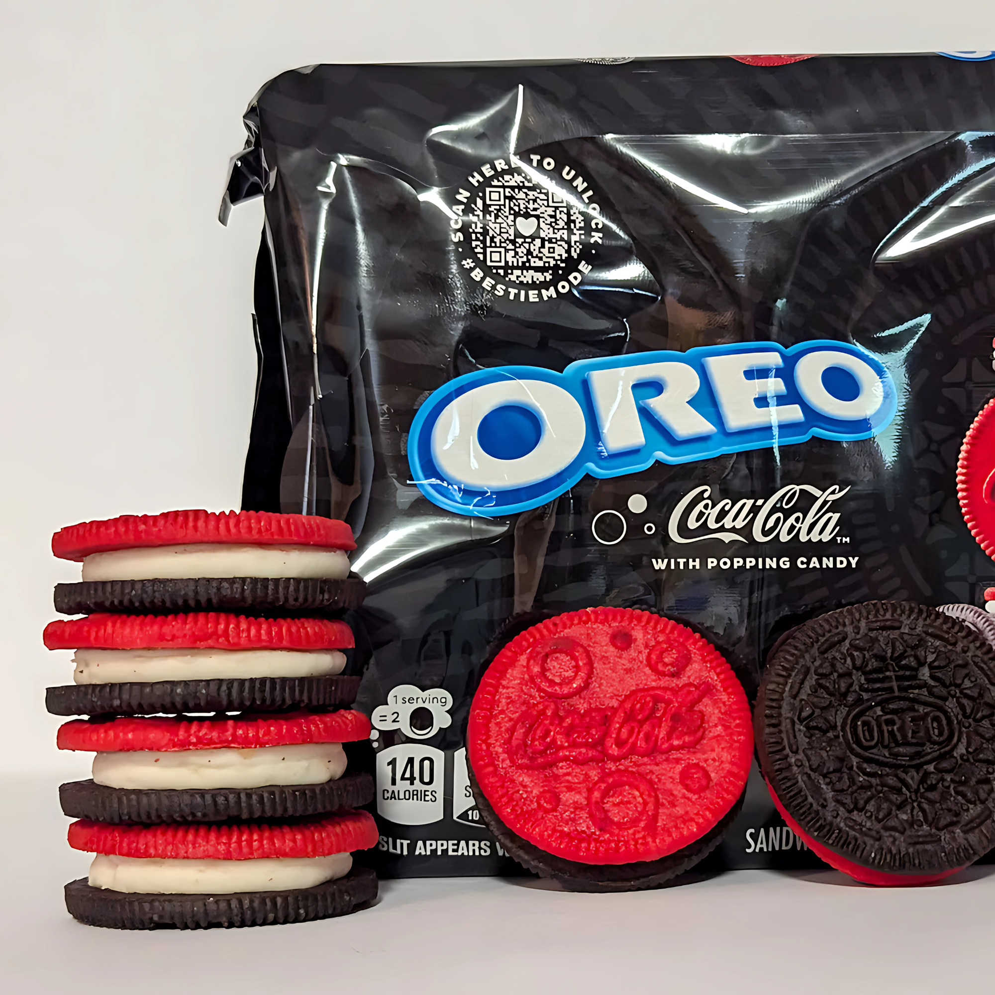 Stack of Coca-Cola Oreo cookies in front of the branded package, highlighting cream and cookie design.