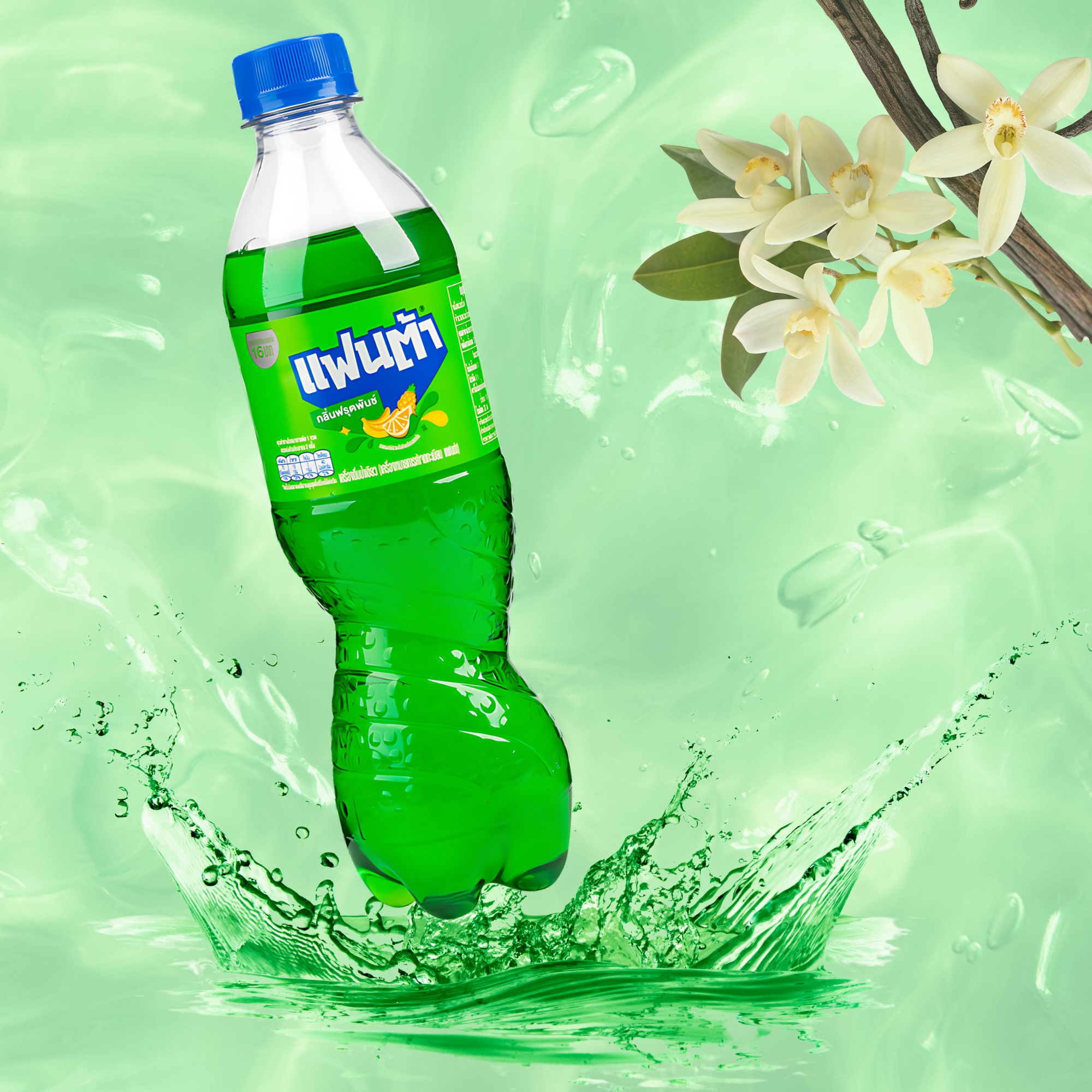 Thai Fanta Cream Soda with vanilla orchid blossoms and light green liquid backdrop