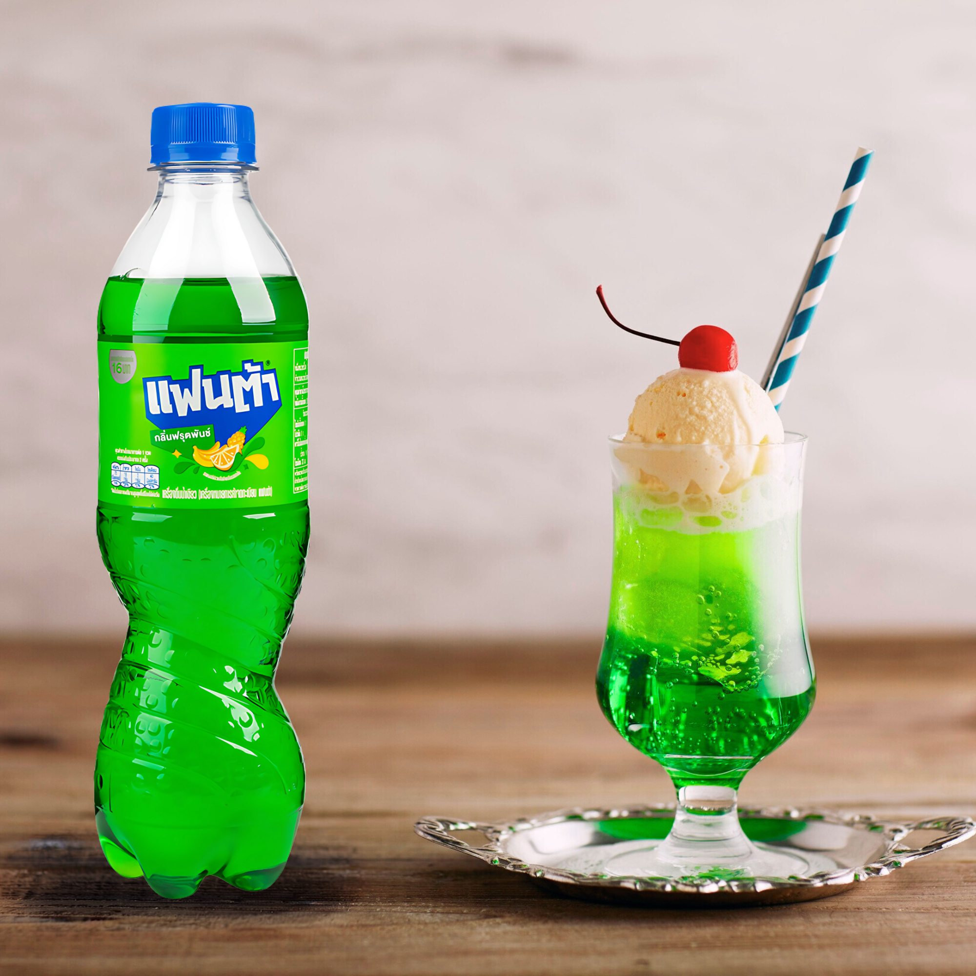 Fanta tropical Cream Soda float with vanilla ice cream and cherry, served in glass