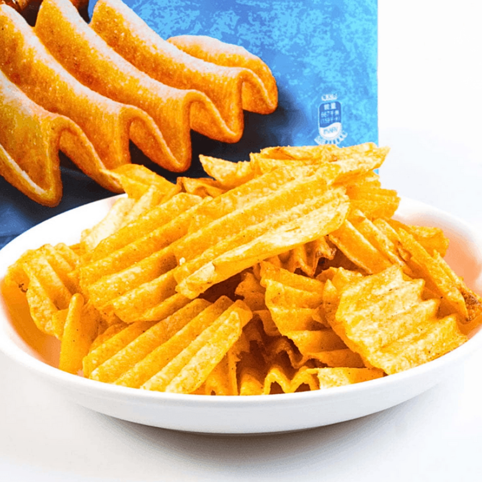 Grilled Squid flavor Lay’s chips in a bowl placed in front of the eye-catching blue and black chip bag.