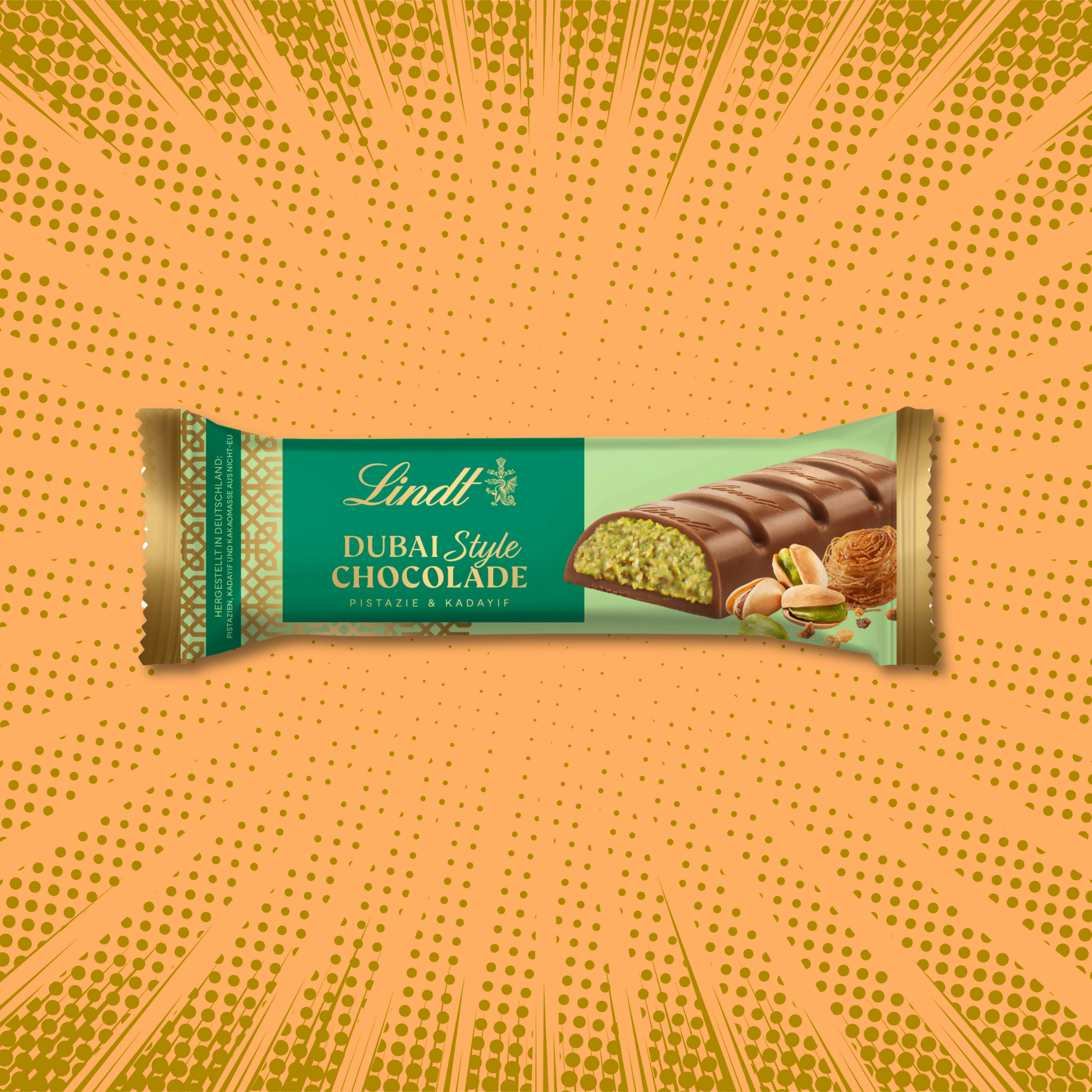 Lindt Dubai Style chocolate bar with pistachio filling on a vibrant orange pop art background.