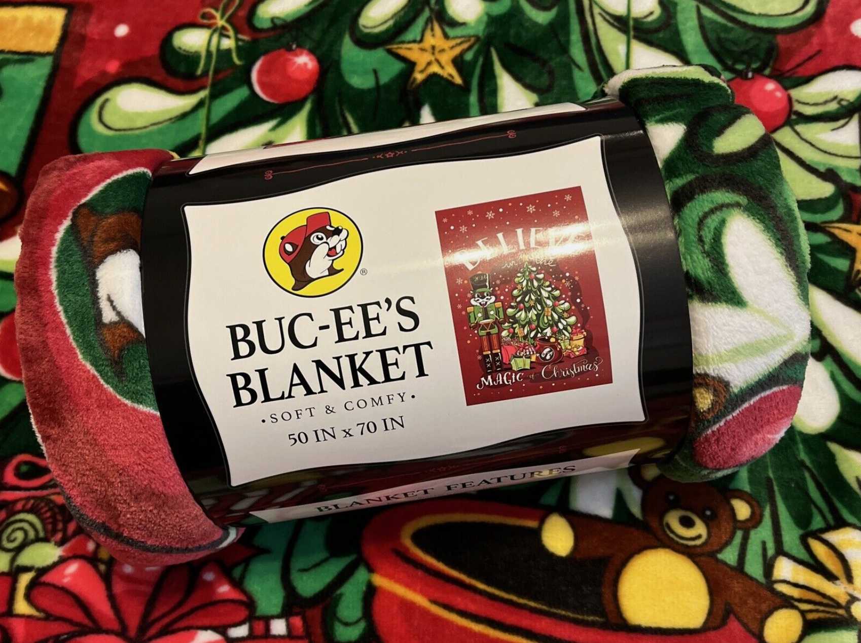 Close-up of Buc-ee's holiday blanket showing soft, plush texture and limited edition label.