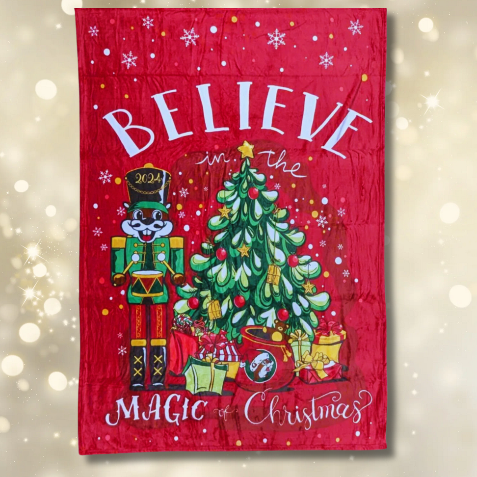 Limited edition Buc-ee's Christmas blanket with 2024 nutcracker and Christmas tree design.