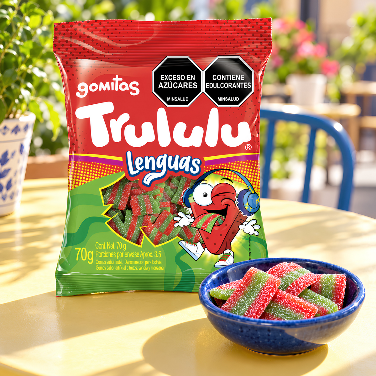 Trululu Lenguas bag with gummy strips in a blue bowl on a sunny table
