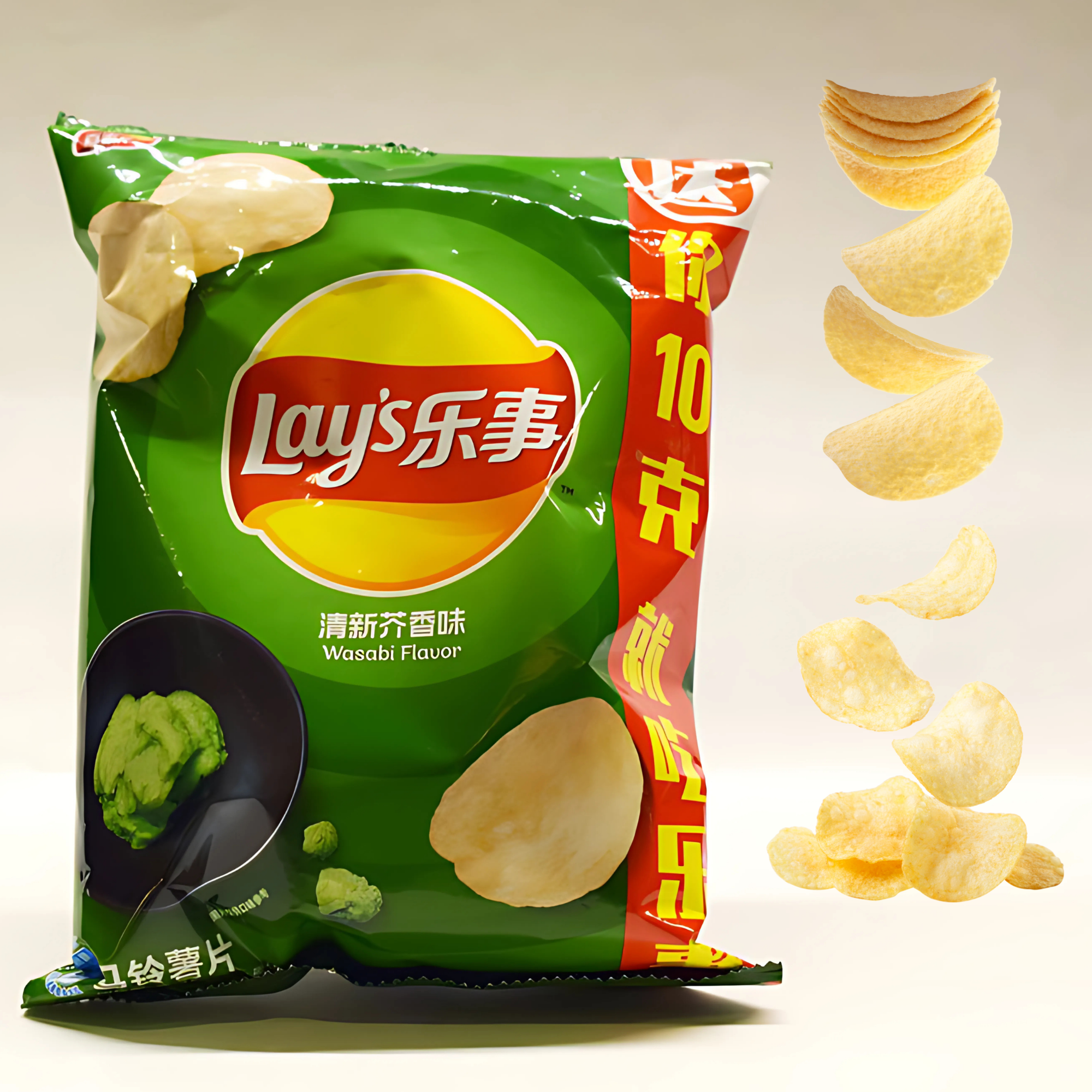 A green bag of Asian Lay's Wasabi Flavor potato chips with bold red and yellow accents. Floating chips are arranged next to it in a dynamic, cascading pattern.
