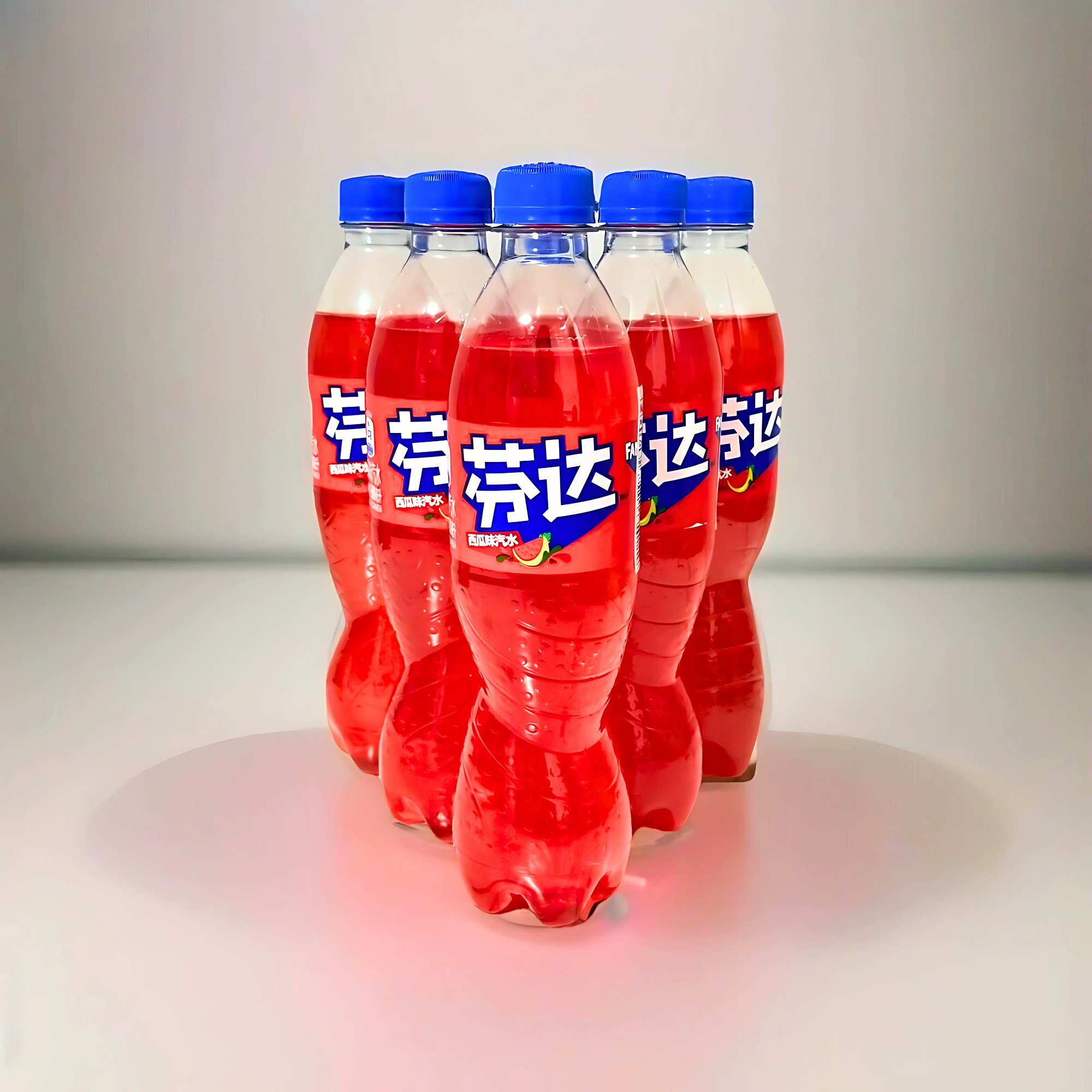 Six Watermelon Fanta bottles arranged in a group on a white surface with soft lighting.