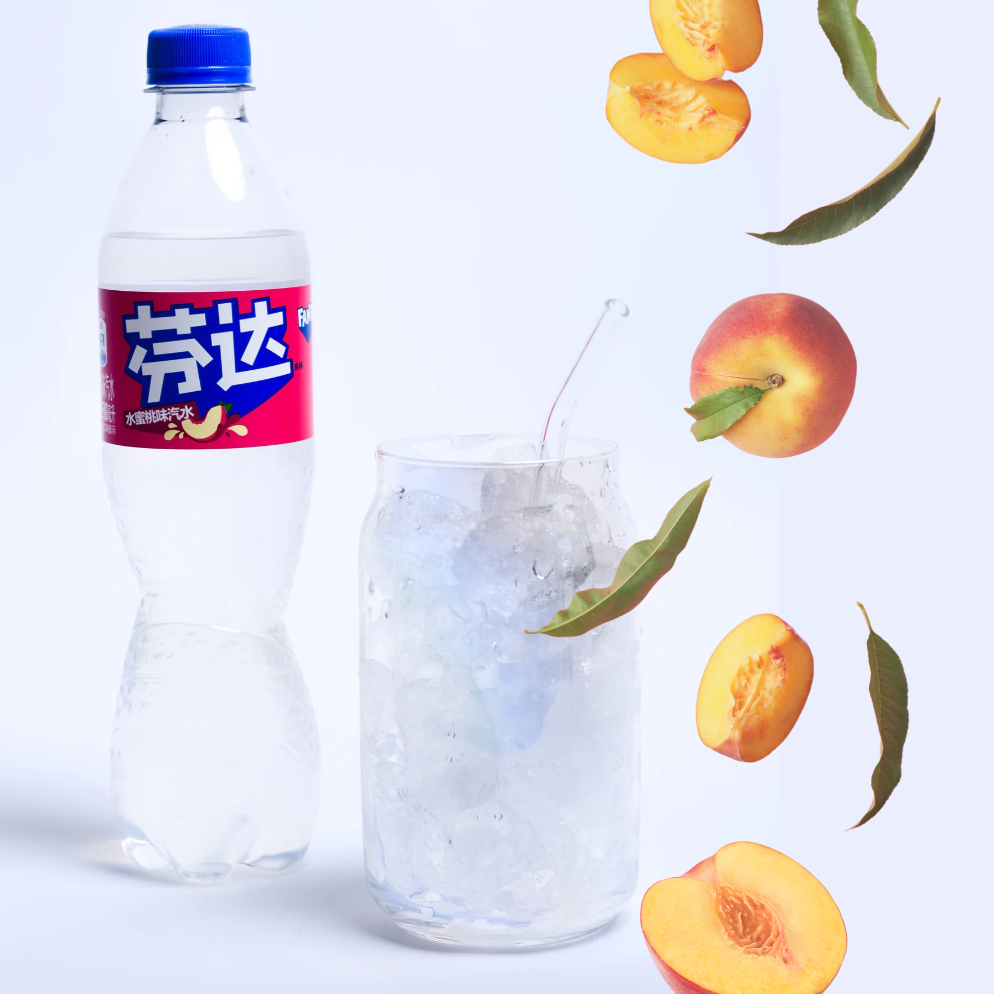White Peach Fanta bottle beside ice-filled glass and fresh peaches, crisp and summery aesthetic.