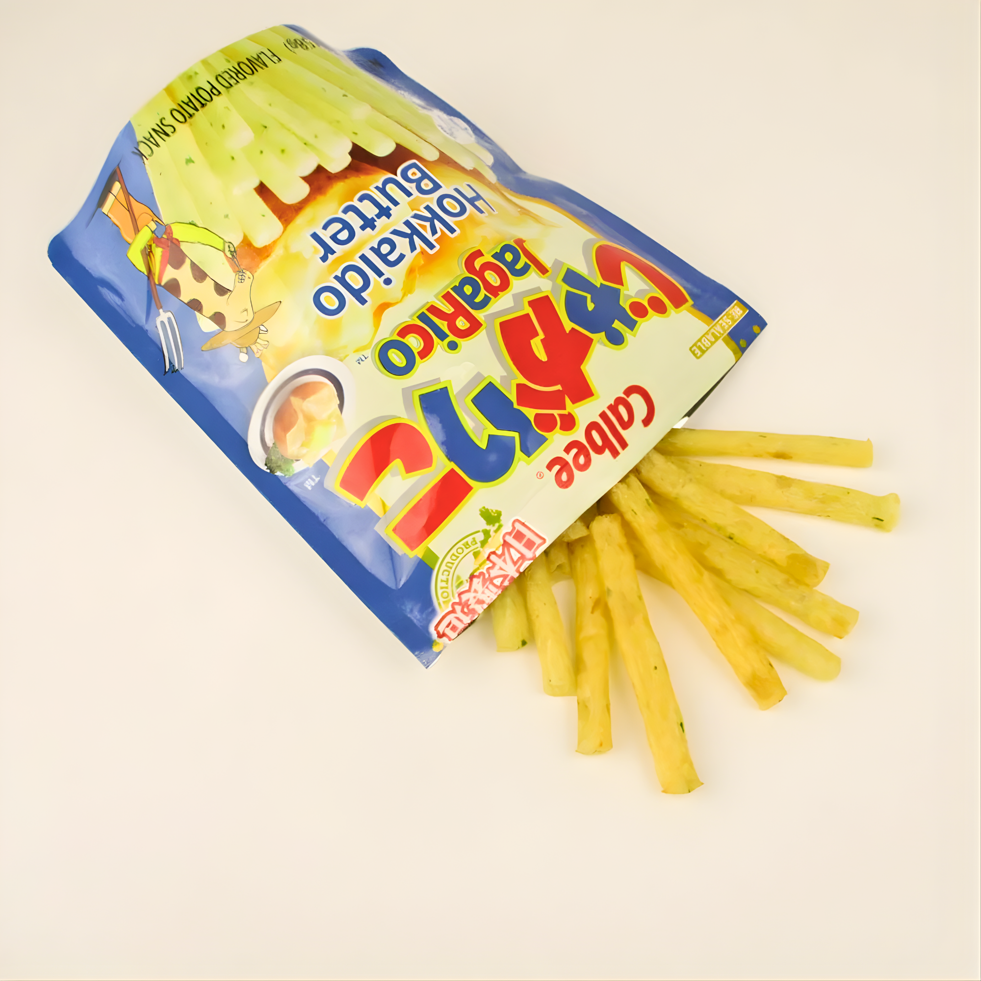 An open blue bag of Calbee Hokkaido butter sticks spills out pale yellow, thin potato sticks on a white surface, suggesting a light and fun snack. Shop Japanese snack box online. 