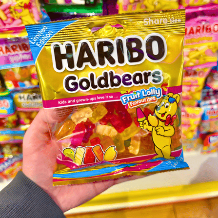 Hand holding a Haribo Goldbears Fruit Lolly Favourites bag