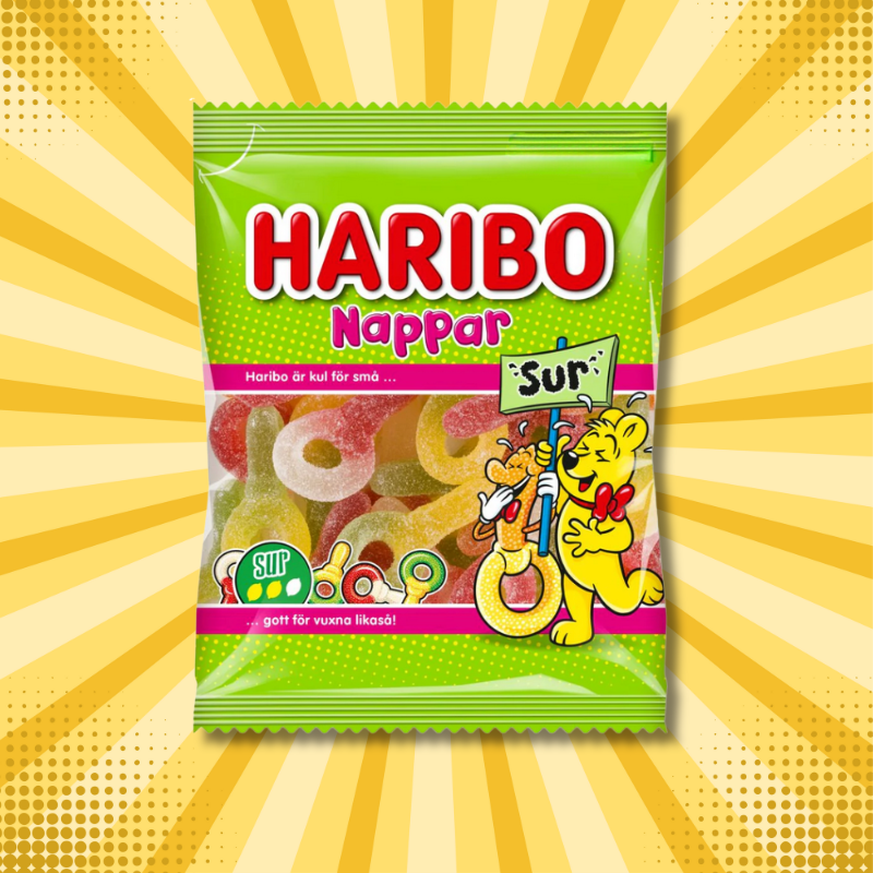 Haribo Nappar Sur Swedish sour gummy rings in original packaging against yellow starburst background. 