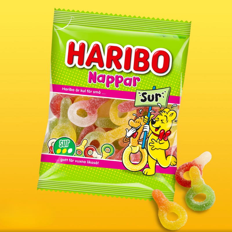 Haribo Nappar Sur sour gummy candy from Sweden in green packaging with gummies featured. 