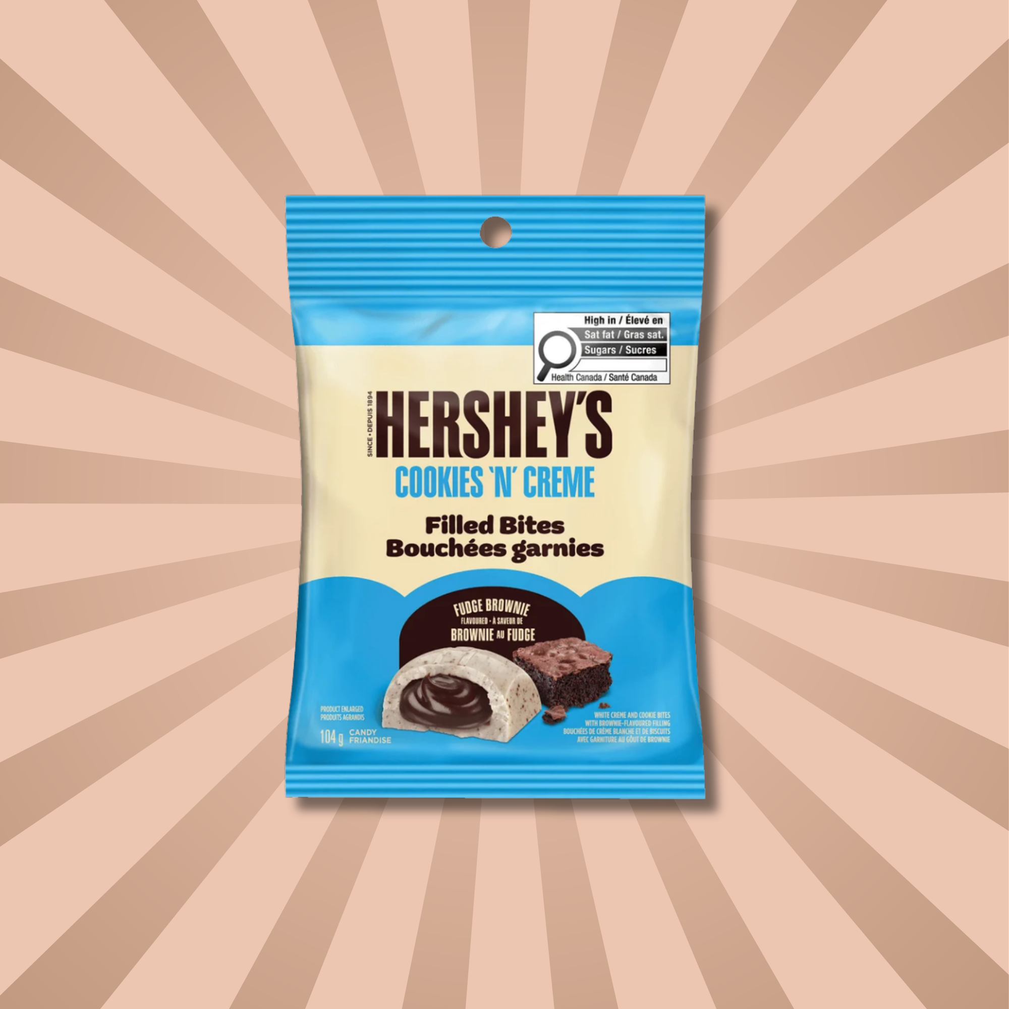 Pack of Hershey's Cookies N Creme Filled Bites from Canada against a creamy starburst background. Shop Canadian candy online.
