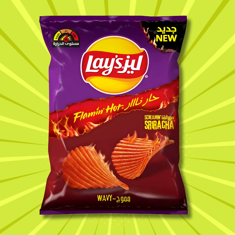 Lay’s Flamin’ Hot Screamin’ Sriracha wavy potato chips from Saudi Arabia in purple packaging with fiery sriracha seasoning against a green starburst background.