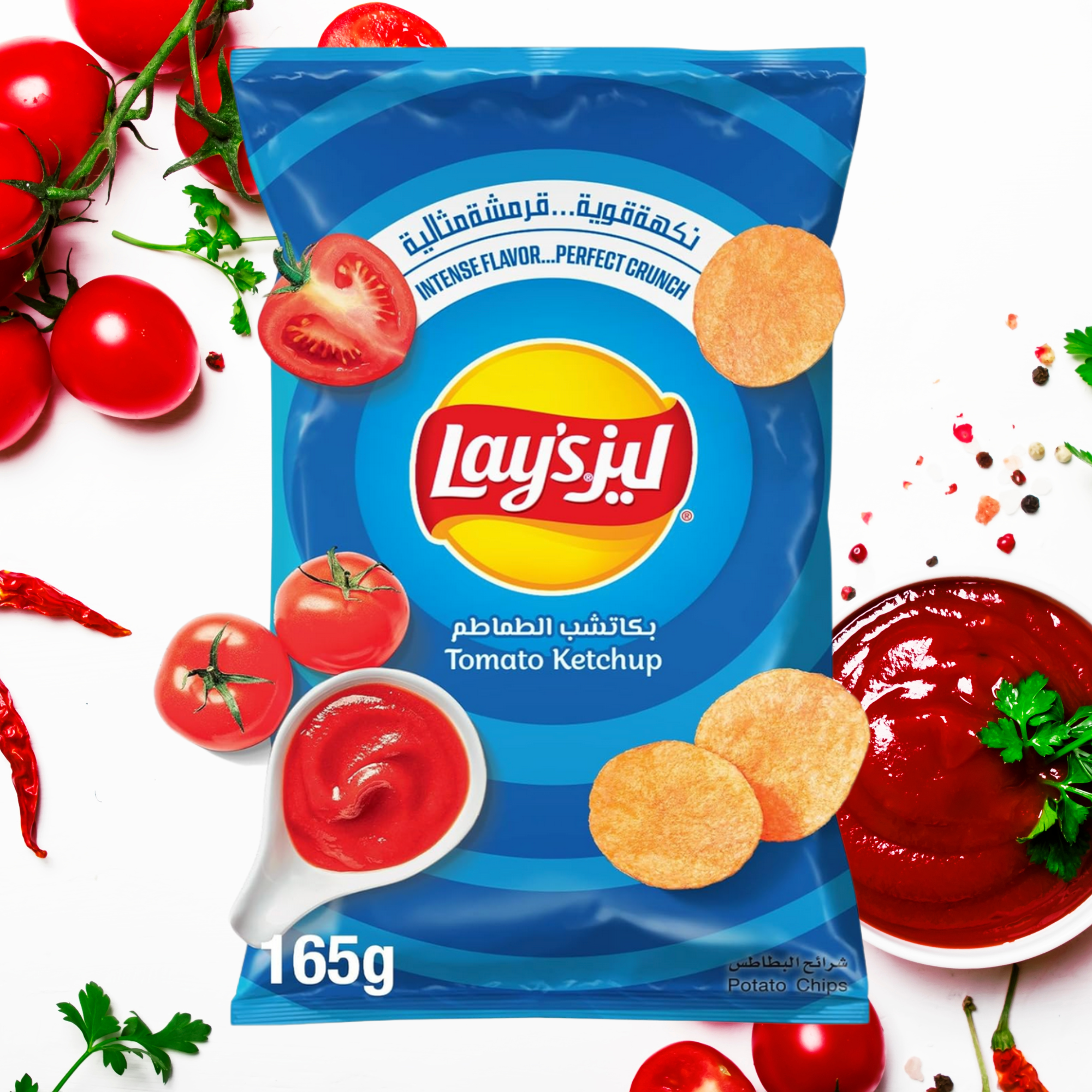 Lay’s Ketchup Chips from Iraq surrounded by tomatoes and ketchup, international Lay’s potato chips.