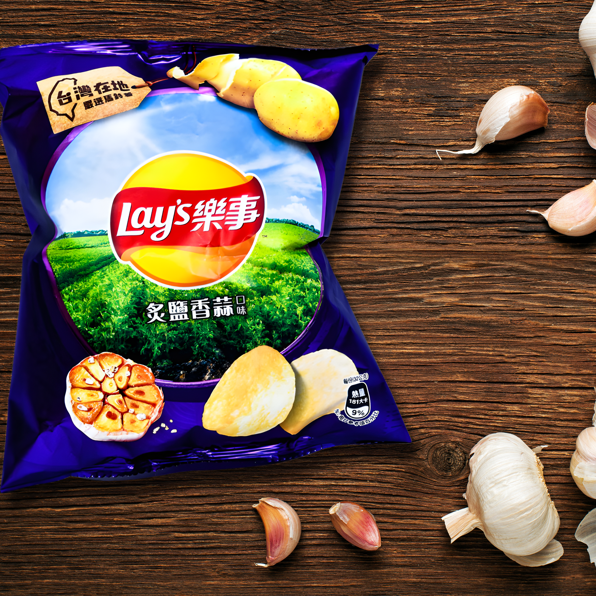 A bag of Taiwanese Lay's Roasted Garlic and Salt chips on a wooden table, surrounded by fresh garlic cloves