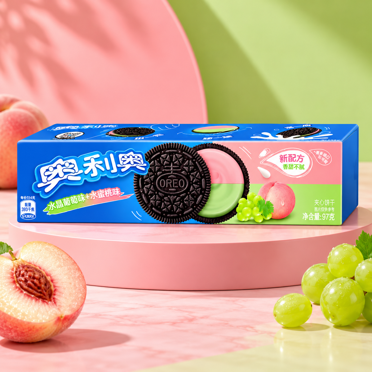 One OREO Peach Grape box on a pink pedestal with peach and green grape props