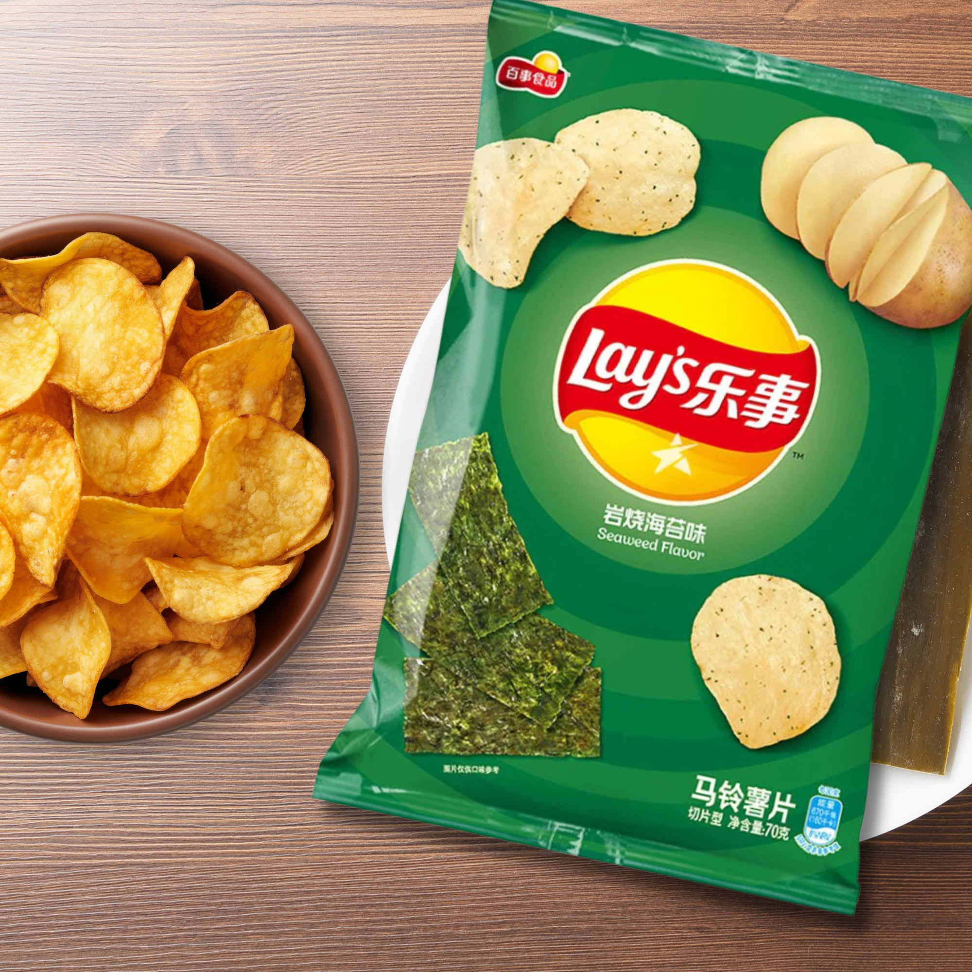 A bowl of golden potato chips next to a green Lay's bag featuring seaweed flavor. Available online.